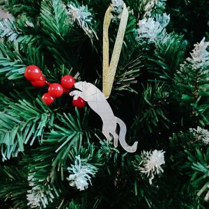 Christmas tree toy “Silhouette of a jumping snow leopard”